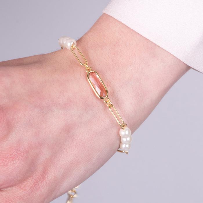 Bracelet en métal avec perles synthétiques et cristaux roses