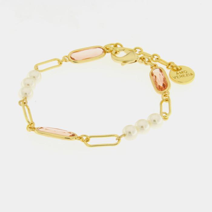 Bracelet en métal avec perles synthétiques et cristaux roses