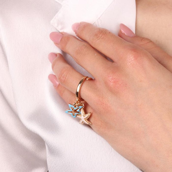Bague en métal avec étoile de mer et cœur