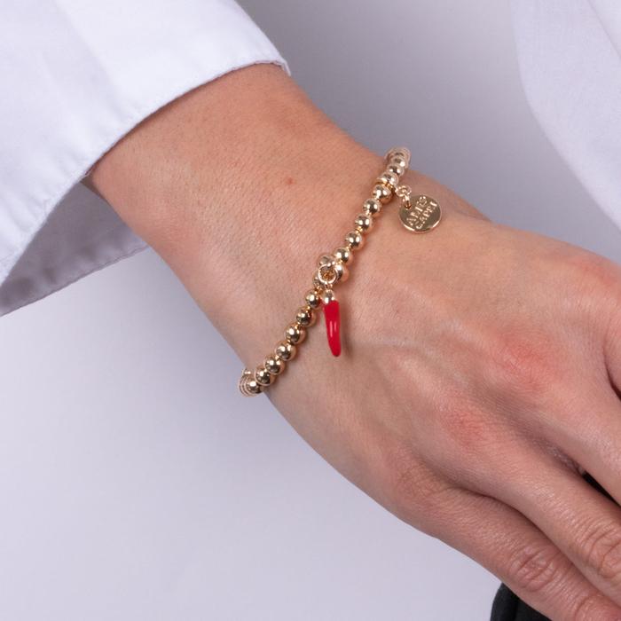 Bracelet en métal avec corne rouge